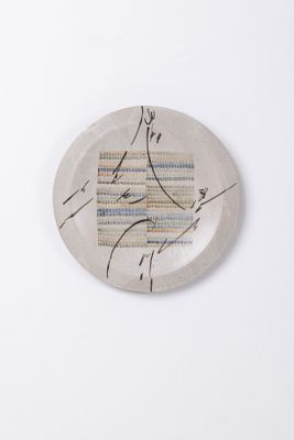 a white plate with a design on it