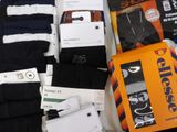 a box of socks and a pair of socks on a table