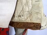 a close up of a pair of boots and a bag on a mannequin