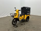 a yellow scooter with a black box on the back of it
