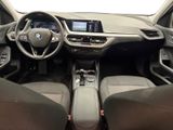 the interior of a car with a steering wheel, dashboard, and dashboard controls