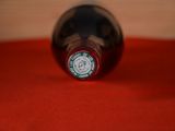a close up of a bottle of wine on a table