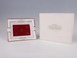 an image of a small white box with a red picture in it