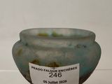 a glass bowl with a label on it that says prado failure enchirres