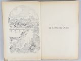 an open book with a drawing of a city in it