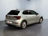 the back of a silver volkswagen vw polo parked in a room
