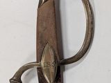 a very old sword that is hanging on the wall