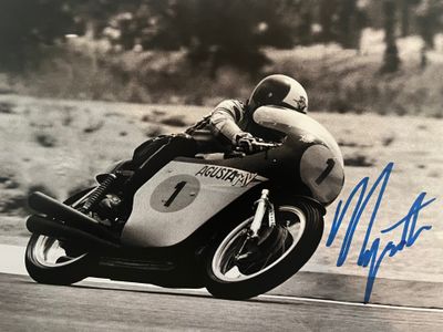 a man that is riding a motorcycle on the road