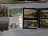 many pictures of boats on display on the wall