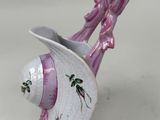 purple and white fish figurine with a hat on it ' s head