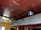 a cell phone on the ceiling of a restaurant