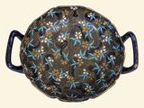 an image of a decorative bowl with handles