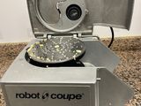 a machine that is sitting on a counter with a sign