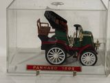 a small model of a car in a glass case