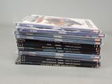 several dvds stacked on top of each other on a table