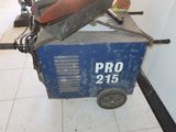 a machine that is sitting on the floor next to a wall