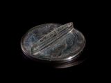 an image of a silver object on a black background