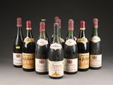 six bottles of wine are lined up in a row