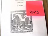 a pink post it on top of an open book