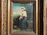 painting of a woman with a basket of flowers in a gold frame