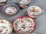 many different types of china plates and bowls on the table