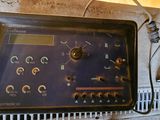 a radio that is sitting on top of a metal grate