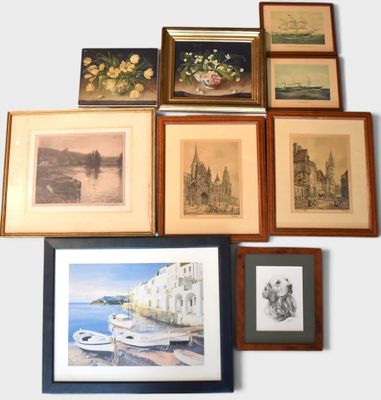 many framed pictures on the wall of a room