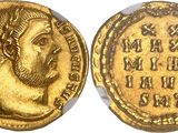 a gold coin with an image of a man on it