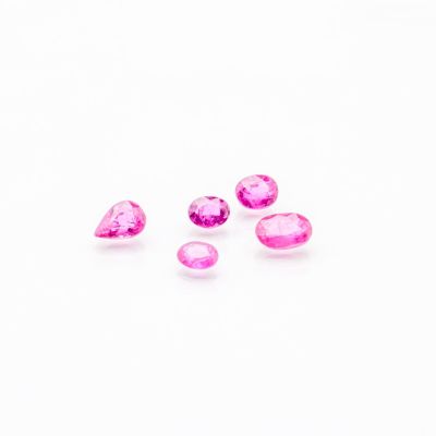 a group of pink sapphires on a white background