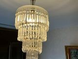 a chandelier hanging from the ceiling in a room
