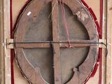 a picture of a wooden object with a cross on it