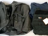 several pieces of luggage are lined up on a white surface