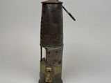 an old metal object with a metal handle on a white background