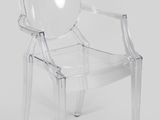 a clear plastic chair sitting on top of a white floor