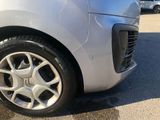 a close up of a car ' s tire on a parking lot