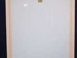 a wooden easel with a white board on top of it