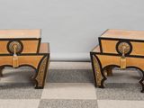 two side tables with a clock on each of them sitting on a checkered floor