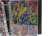 the inside of a binder with a bunch of comics on it