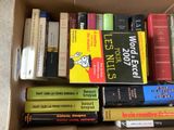 a box full of books that are sitting on the floor