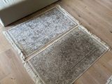 a couch and a rug on the floor in a living room