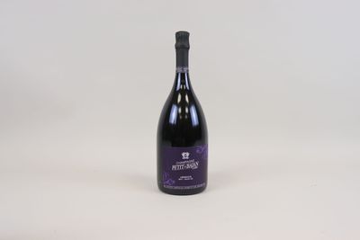 a bottle of wine that is sitting on a table