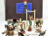 many figurines of people and animals on display