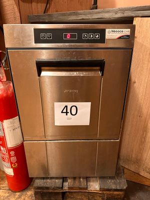 an image of a stainless steel dishwasher and fire extinguisher