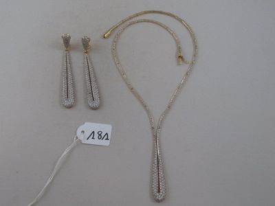 two silver necklaces and a pair of earrings on a white surface