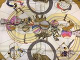 a picture of a table cloth with a picture of animals on it