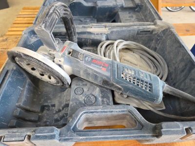 a tool in a tool box on a wooden table