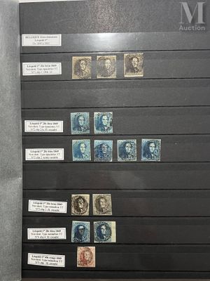 a display of stamps on display in a glass case