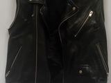 black leather jacket on a hanger on a white background