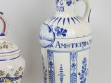 two blue and white vases sitting next to each other