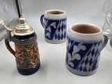 three coffee mugs sitting next to each other on a table